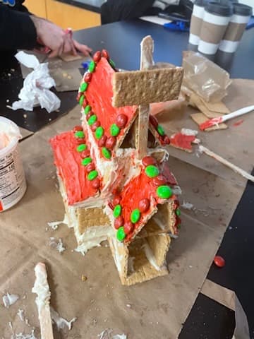 A gingerbread house with a M&M's