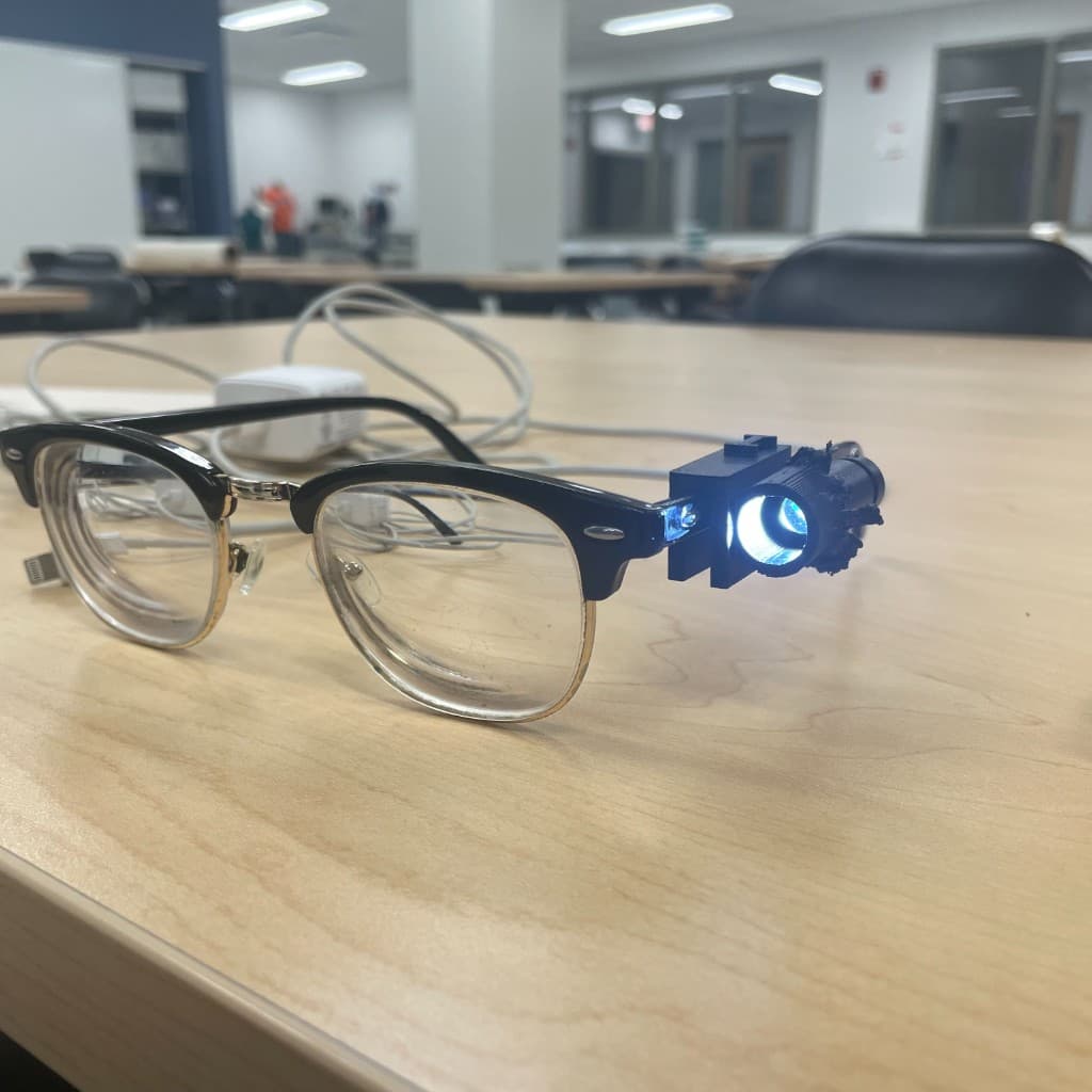 Eyeglasses with a small mounted light module on one side